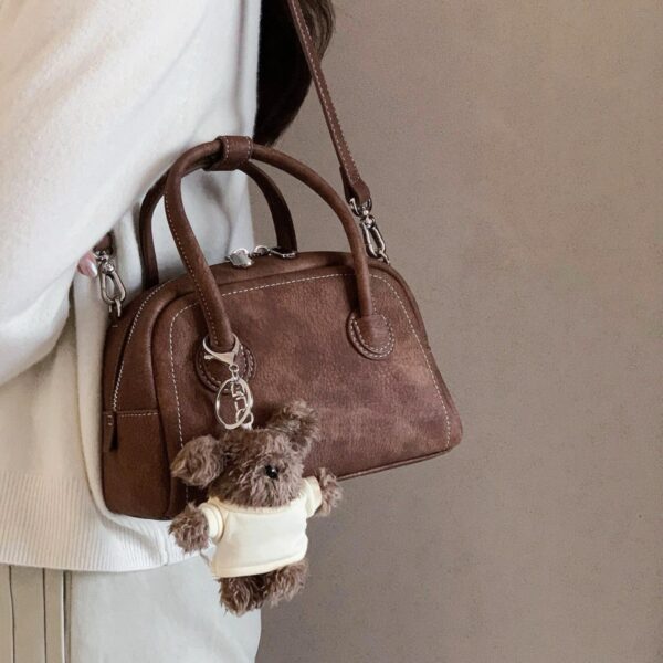 oly-06f757a31bd271f91d16d5d9120f63b6 Wholesale Korean niche brown bowling ball handbag for women, autumn/winter style, high-end retro crossbody bag.