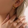 Wholesale Sugar Hollow Love Earrings Earrings Titanium Steel PVD Electroplated 18K Real Gold Niche Simple Elegant Earrings for Women
