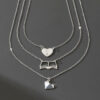 oly-086657176dd006b1fe8da1081ae193e7 Wholesale 3 fashionable exquisite metal love book three-dimensional heart pendant literary temperament ladies necklace suit
