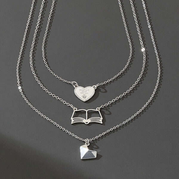 oly-086657176dd006b1fe8da1081ae193e7 Wholesale 3 fashionable exquisite metal love book three-dimensional heart pendant literary temperament ladies necklace suit
