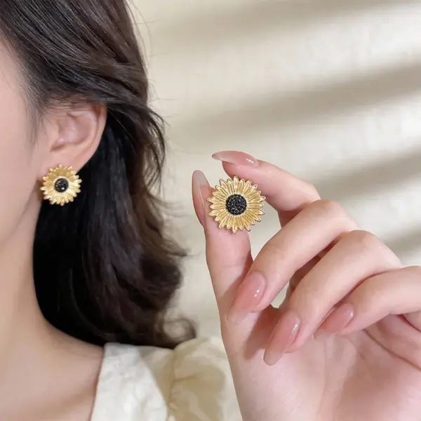 Wholesale Sunflower Stud Earrings For Women In Dyed Black Copper With Real Gold Plated Finish