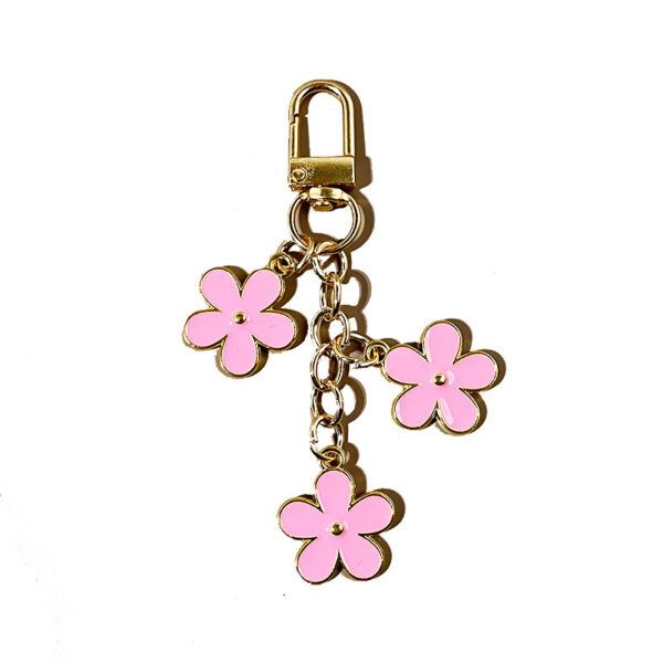 oly-09d9436a81e483e6d2aa4c59d87c07ec Wholesale double-sided drip oil color flower alloy keychain creative Airpods bag pendant