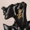 Wholesale Hypoallergenic Flowers Drop Earrings For Women In KC Golden Plated Copper With Rhinestones And UV Plating