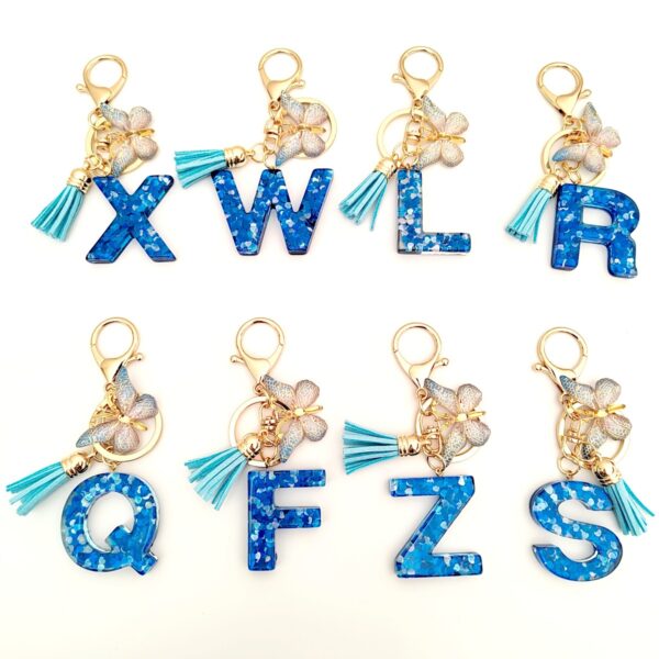 Wholesale blue crystal epoxy letter key chain pendant resin sequined butterfly key chain batch