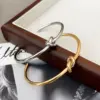 Wholesale 18K Gold Plated 304 Stainless Steel Solid Color Knot Bangle