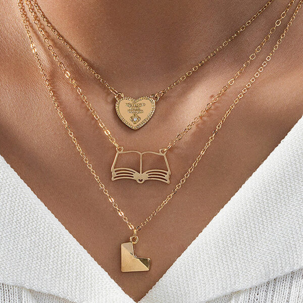 oly-129e540bdb17919310bc9e618ce4a299 Wholesale 3 fashionable exquisite metal love book three-dimensional heart pendant literary temperament ladies necklace suit