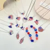 oly-1667730c4089a226a8263a44a29a6403 Wholesale Fashion Simple American Independence Day Rhinestone Wings Heart-shaped Pendant Alloy Necklace Set