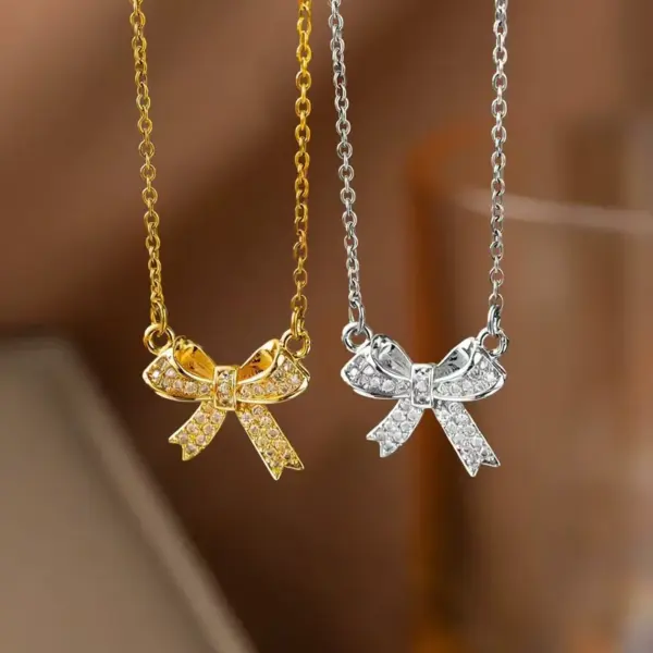 Wholesale Women’s Bow Tie Pendant Necklace With Inlay Artificial Rhinestones, 18K Real Gold Plated Copper, Water Plating On Cable Chain