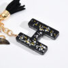 Wholesale resin black English letter car key chain pendant butterfly pendant tassel key chain decoration