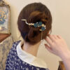 Wholesale high-grade tassel one-word hairpin back head plum blossom clip metal frog buckle twist clip headdress