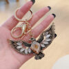 oly-1a448346ae5ca77e60dad3841d954090 Wholesale creative Opal eagle wing retro key chain car key chain accessories decoration key pendant