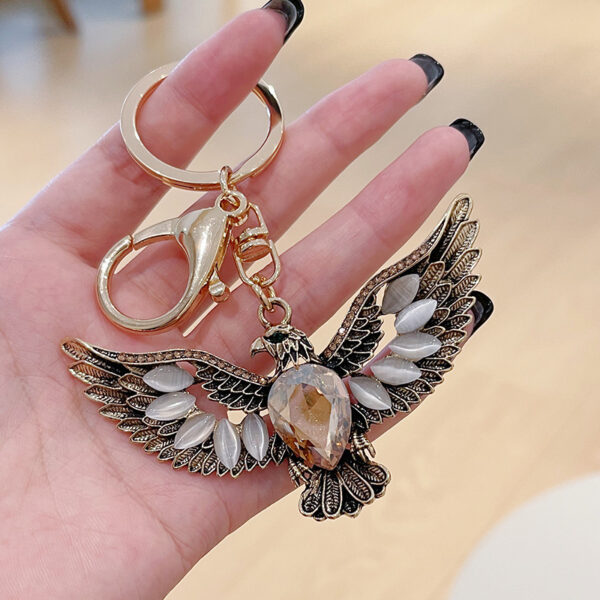 oly-1a448346ae5ca77e60dad3841d954090 Wholesale creative Opal eagle wing retro key chain car key chain accessories decoration key pendant