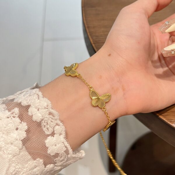 oly-1f6541f0123cfc9de1f8572705957705 Wholesale Gold Double-Sided Butterfly Bracelet for Women, Niche Design, Light Luxury, High-End, Versatile and Exquisite Hand Jewelry