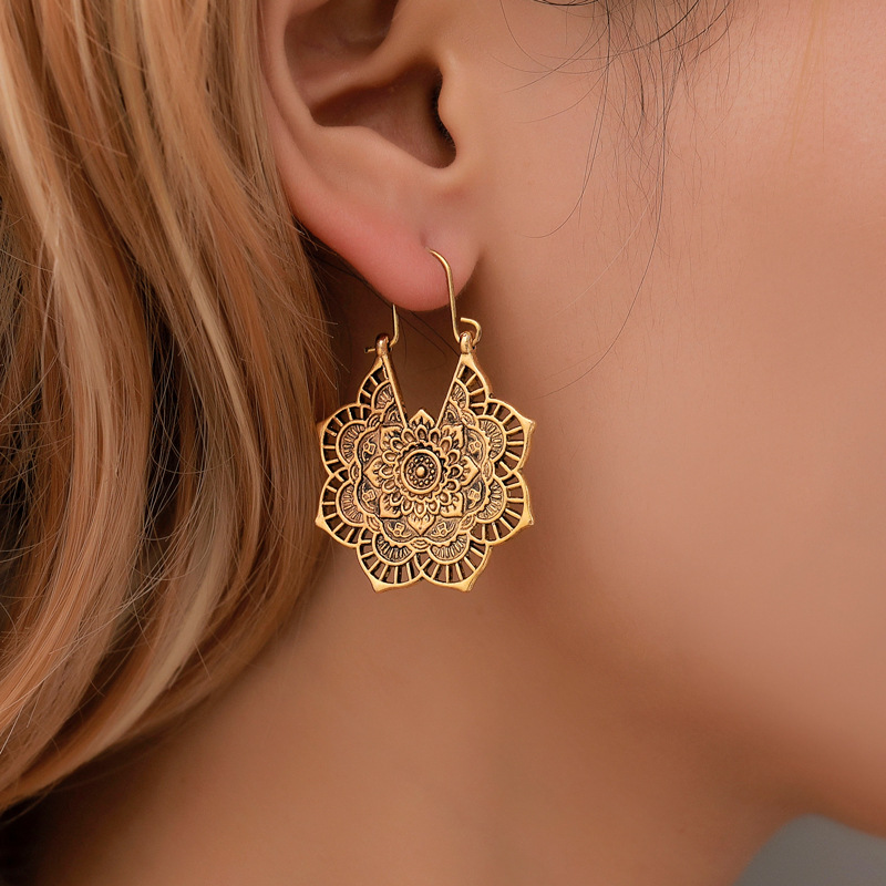 Wholesale Ethnic earrings exotic mood retro metal hollow flower earrings Bohemian carved court style earrings