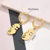 Wholesale Best Seller In 304 Stainless Steel Water Plating Furnace Vacuum Plating Light Gold Snowflake Cat Heart Key Feather Pineapple Small Size Hollow Face Earrings Earrings