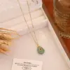 Wholesale Bohemian Water Droplets Pendant Necklace For Women With Gold Stone Texture And Rhinestone Inlay On Cable Chain