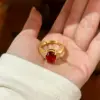 Wholesale Geometric Open Ring For Women In Brass With Golden Plated Water Plating And Claw Setting Featuring Artificial Gemstones