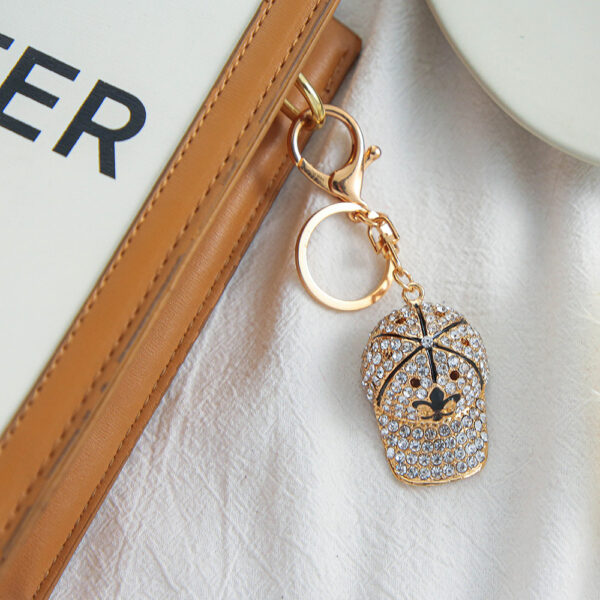 oly-2465197144b8a7beb58c86c506d8baae Wholesale cute hat key chain wholesale diamond cartoon baseball cap metal key pendant ornaments small merchandise