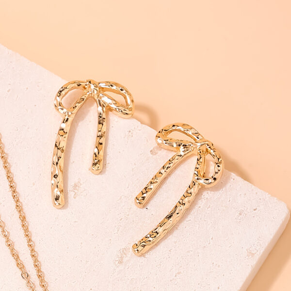 Wholesale 1 Pair Ig Metal Style Simple Spring and Summer Earrings Hollow Bow Women Commuter Earrings Earrings Stud