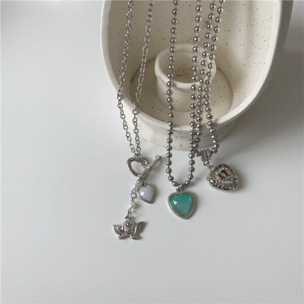 oly-255d559f6d2adf65cb40ff563407c08b Wholesale Korean blogger with Angel jelly love hollow diamond heart necklace titanium steel fashionable clavicle chain for women