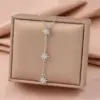 Wholesale Starburst Inlay Pendant Necklace For Women In Copper With 18K Real Gold Plated Water Plating And Artificial Rhinestones On Cable Chain