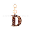 oly-26ee427237ad74edac36d88dc0435e98 Wholesale Acrylic leopard print letter keychain 26 letters complete creative fashion jewelry transparent pendant gift