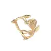Wholesale Rose Pattern Couple Rings In Copper With 14K Real Gold Electroplated Finish Featuring Artificial Gemstones