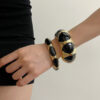 oly-284dbebb0e2c36e6d16e806f1a26f609 Wholesale French Niche Design Retro Black Gold Enamel Stacked Wearing Wide Bracelet Women's Light Luxury High-end Refined Open Bracelet