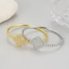 Wholesale Simple Style Circle Bangle In Copper With 14K Real Gold Electroplated Finish Featuring Zircon Inlay