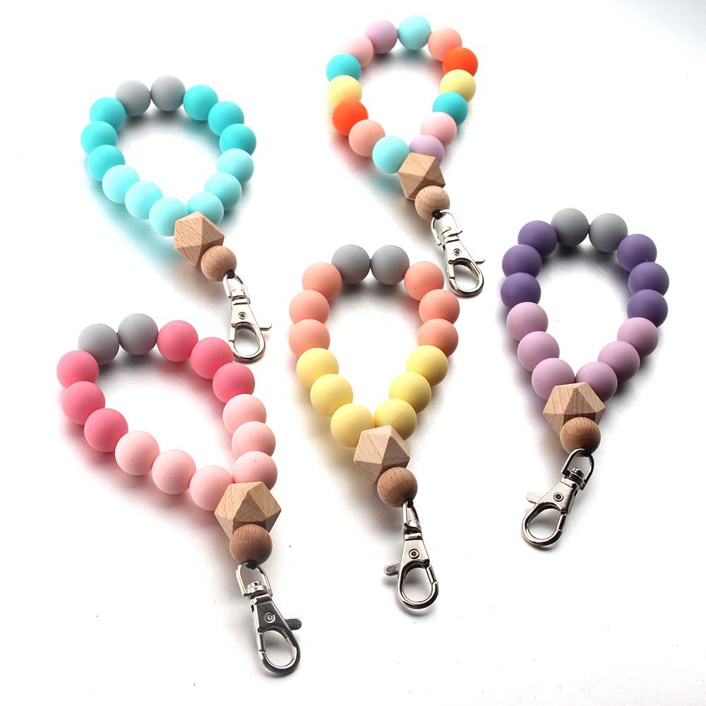 Wholesale Amazon Silicone Bead Wrist Bracelet Keychain Beech Wood Bead Metal Silicon Glue Bracelet Key Ring