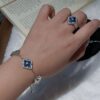 Wholesale Copper Italian brushed four-leaf clover blue Peter Pan set necklace and bracelet, retro court style, medium-sized, Buchi light luxury jewelry.