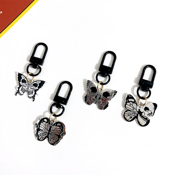 oly-2b1bf0d94fcc3027e51f701e08cfe270 Wholesale game series trendy skull butterfly keychain Halloween vintage pendant cold style all-match OLY Exclusive