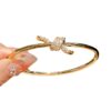 oly-2b715741aadd85a4af42c49dfe0bbd39 Wholesale Electroplated Copper and Plastic Snap-Clasp Bracelet — Full-Pavé, Rope-Knot Design, Non-Fading Jewelry