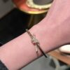 oly-2c9639cd992b20ab48a24828bcf3bef2 Wholesale Electroplated Copper and Plastic Snap-Clasp Bracelet — Full-Pavé, Rope-Knot Design, Non-Fading Jewelry