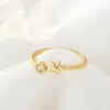 Wholesale Women’s Star Ring In Copper With 14K Real Gold Electroplated Finish Featuring Moissanite Inlay