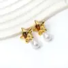 Wholesale Vacuum Electroplating (In Furnace) Plated Imitation Gold Imitation Pearl Starfish Earrings Ladies 304 Stainless Steel Oval Cat's Eye Earrings Fashion Irregular Geometric Shape