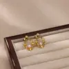 Wholesale Round Waterproof Non Tarnish Stud Earrings For Women In Copper With 18K Real Gold Plated PVD Coating And Artificial Pearl Inlay