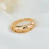Wholesale Women’s Open Star Ring With Bezel Setting, Electroplated Copper Featuring 14K Real Gold Plating And Zircon Inlay