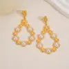 Wholesale Imitation Gold Plated 304 Stainless Steel Water Plated Artificial Gemstone Water Drop Hollow Vacuum Electroplated Waterproof Non-Fading Earrings For Women