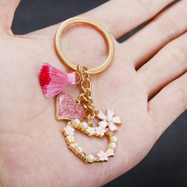 oly-37cea3dd7e3c41b0b9b052250fb39e0e Wholesale AliExpress Explosions Beautiful Girl Heart Pink Tassel Pearl Flower Love Keychain Jewelry Luggage Pendant