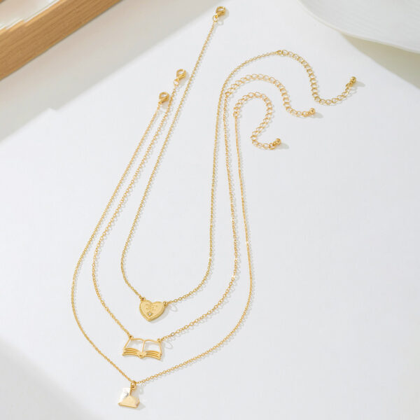 oly-3975cd3171aacbc17a9a42ddff16bff4 Wholesale 3 fashionable exquisite metal love book three-dimensional heart pendant literary temperament ladies necklace suit