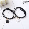 oly-3d8edff992899344db63f78c557b9a64 Wholesale Black and White Ghost Bracelet Couple Bracelet Pair for Boyfriend Small Leather Case Heart Magnet Attraction Bracelet Headband for Women