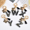 Wholesale resin black English letter car key chain pendant butterfly pendant tassel key chain decoration