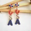 oly-42f8d7902d5bd6514ec8416354684751 Wholesale 1 Pair IG Style Retro Classic Style Letter Inlay Alloy Seed Bead Drop Earrings