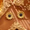 Wholesale Sunflower Stud Earrings For Women In Dyed Black Copper With Real Gold Plated Finish
