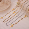 Wholesale British Style Retro Niche Personality Jewelry Embossed Figure Round Brand Tassel Cross Pendant Titanium Steel Gold Plated Necklace