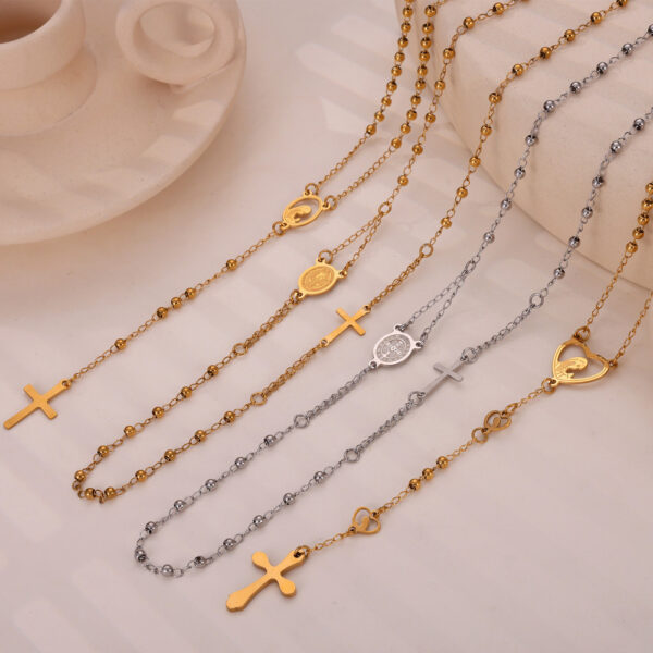 Wholesale British Style Retro Niche Personality Jewelry Embossed Figure Round Brand Tassel Cross Pendant Titanium Steel Gold Plated Necklace