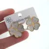 Wholesale Women’s Enamel Flowers Stud Earrings Made Of Titanium Steel With Electroplated Gold Plating Process