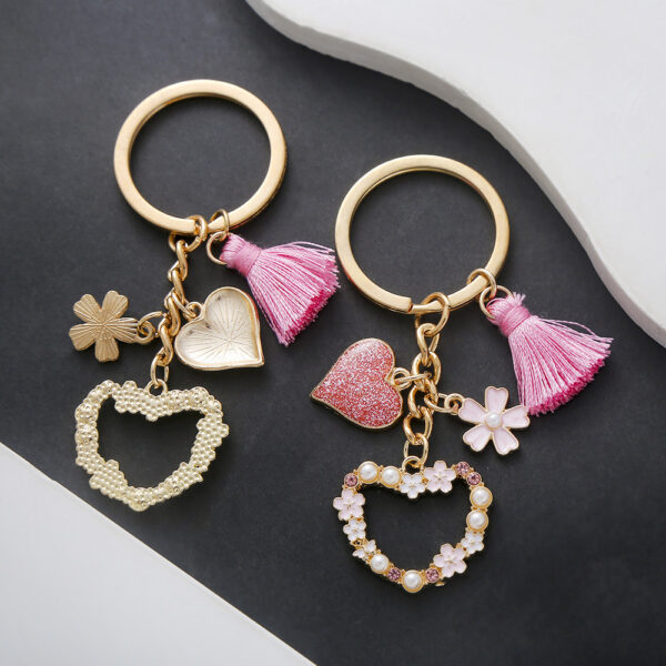 oly-456e4a92c692581db812bd1d417ac07a Wholesale AliExpress Explosions Beautiful Girl Heart Pink Tassel Pearl Flower Love Keychain Jewelry Luggage Pendant