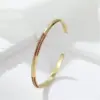 Wholesale Round Inlay Copper Cuff Bracelet For Women With Electroplated Gold Plating And Rhinestone Details